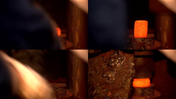 铁匠用金属钳把烧过的铁锭放在压力机下