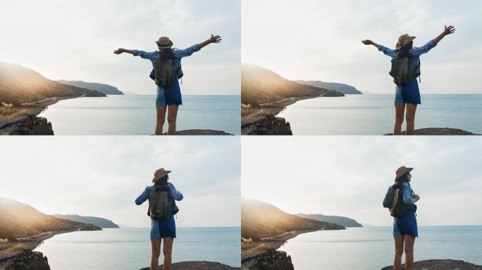 妇女在高山旅游减压治愈面向大海呼喊张开双