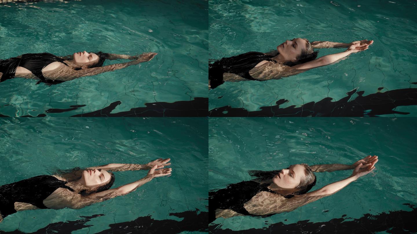 游泳池里的女人惬意舒适悠闲享受漂浮放空
