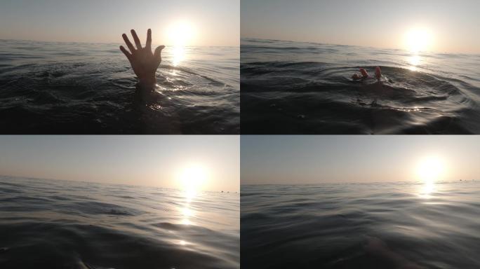 一个溺水者的手举起来求救