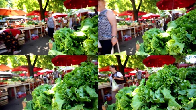 人们在普拉的绿色市场购买蔬菜。