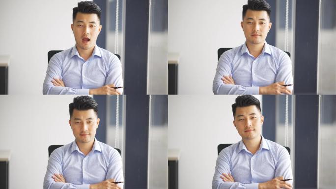 年轻男性商务人士办公室坐着休息