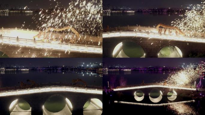 4K航拍新年夜景桥上舞龙火花视频素材