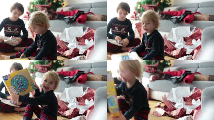 穿着睡衣的孩子们兴奋地在家里打开礼物