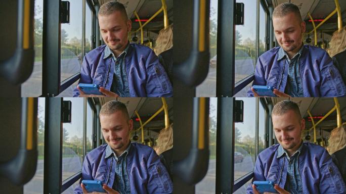 一个年轻人在公交车上使用智能手机