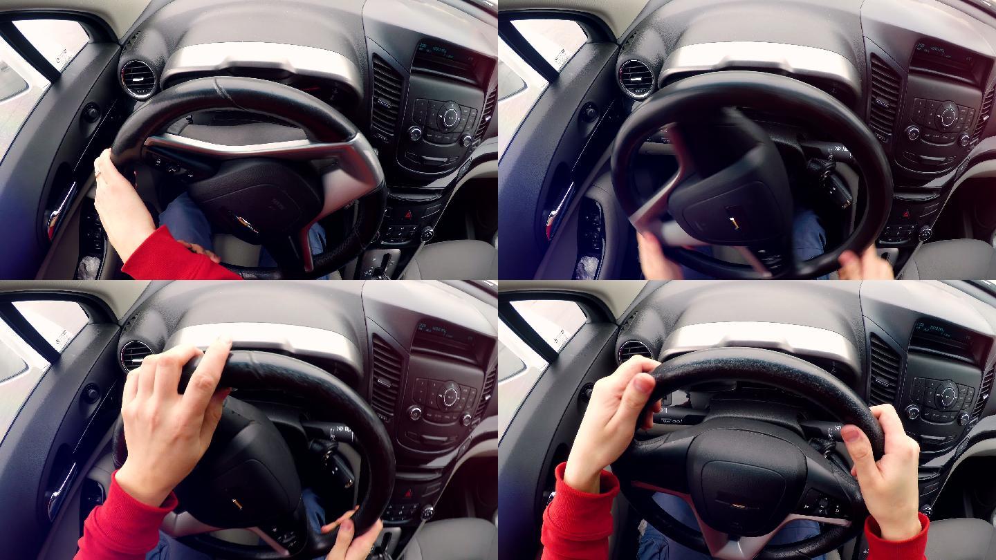 男人用手转动汽车方向盘。