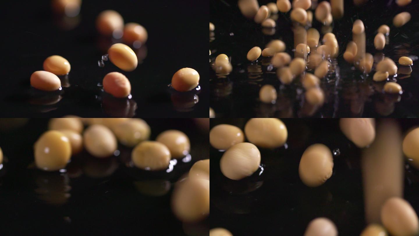 黄豆豆子洒落水中水滴意象特写A024