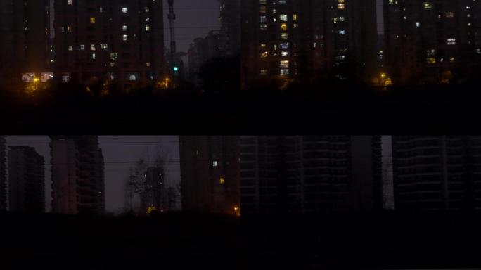 列车窗外城市夜间风景
