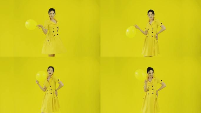 穿着黄色连衣裙的快乐女孩。