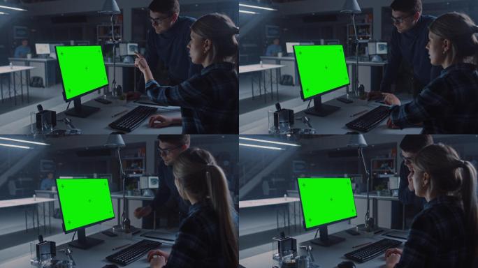 工程师在显示绿色屏幕电脑上工作。