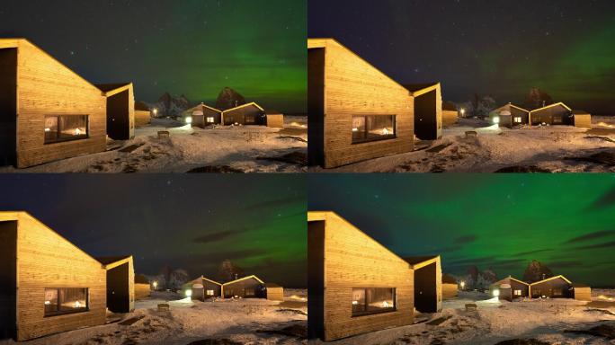 挪威的北极光北极圈雪山冰川房屋木屋