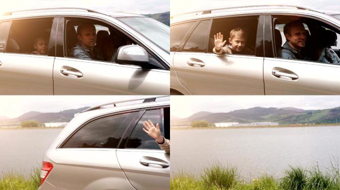 一家人开车离开：男孩从开着的窗户挥手