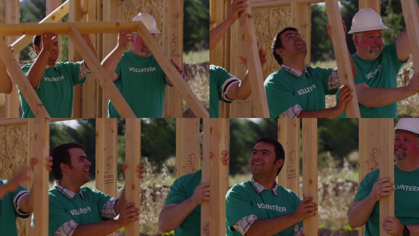 志愿者在建设项目上扶起木框