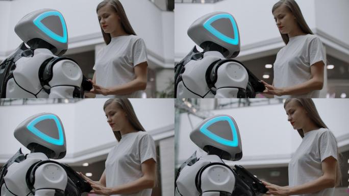 女孩正在与类人机器人接触