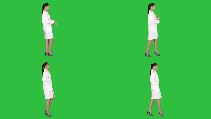 年轻女药剂师走在绿色屏幕上
