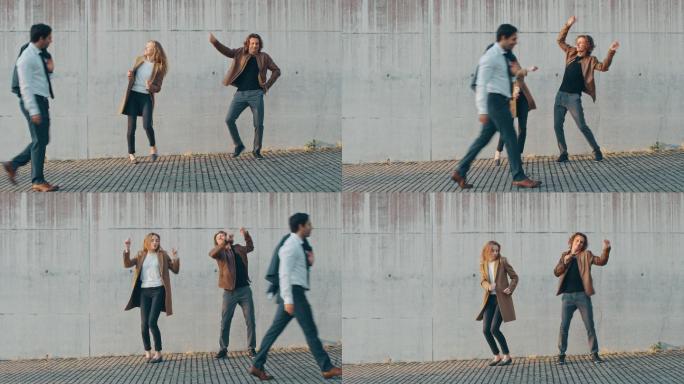 一个女孩和一个年轻人正在街上跳舞