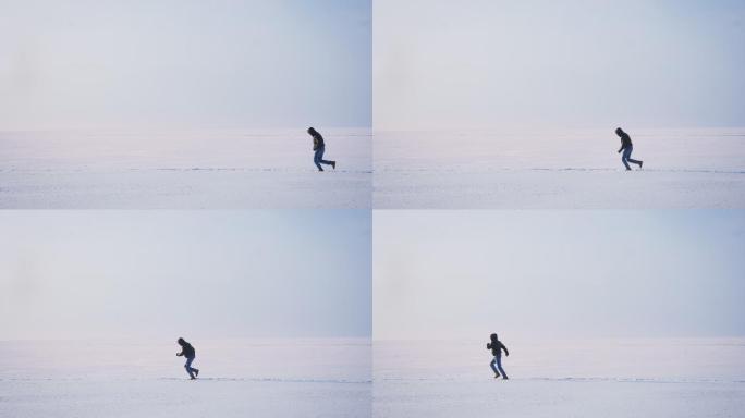 在雪地上快速向左奔跑的男性