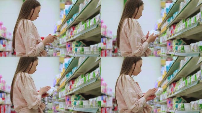 年轻女子在超市挑选婴儿湿巾