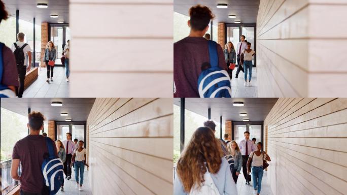 学生和老师在学校大楼之间行走