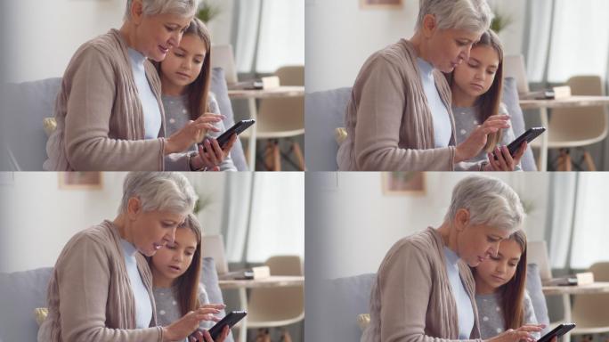 孩子教祖母使用智能手机