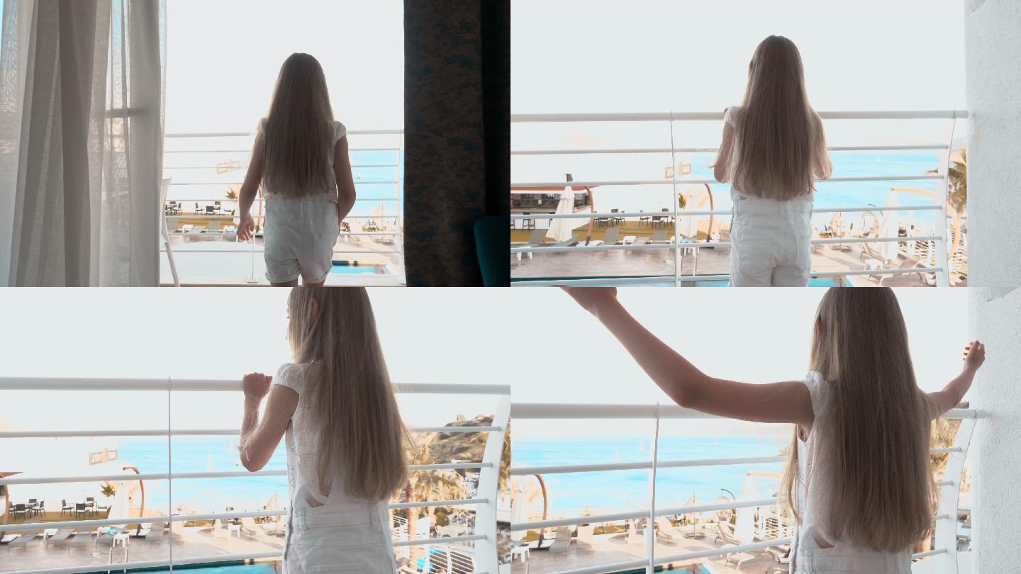 女孩进入度假酒店的阳台欣赏海景