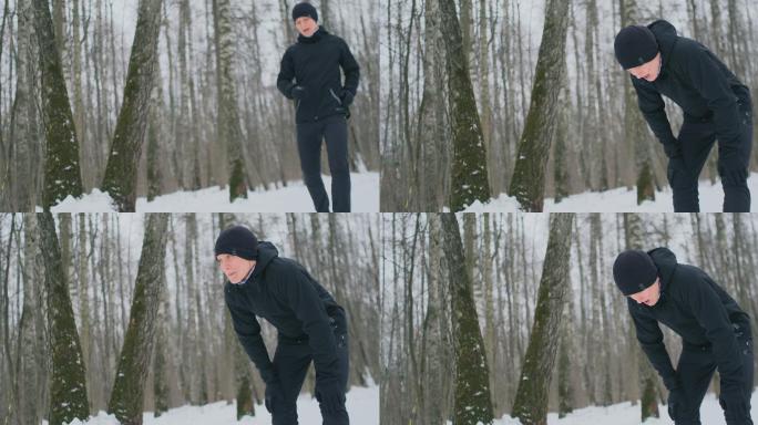 一个在冬季森林晨跑的年轻人累了