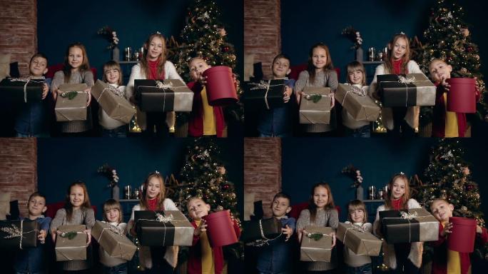 五个可爱的孩子展示圣诞礼物