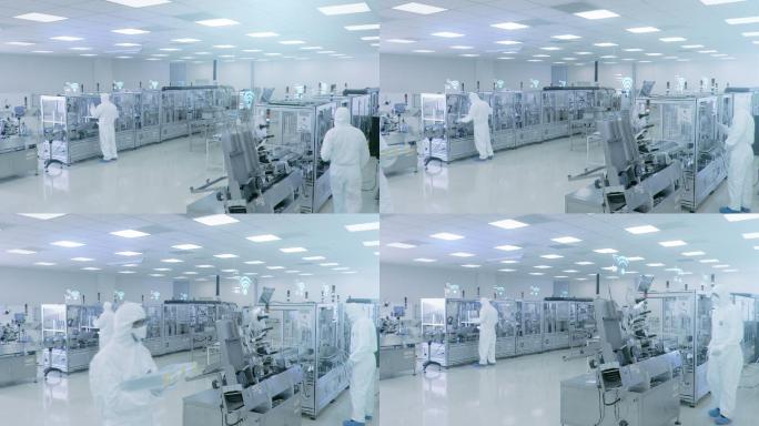 制造工厂工人使用工业高精度机械组装产品。