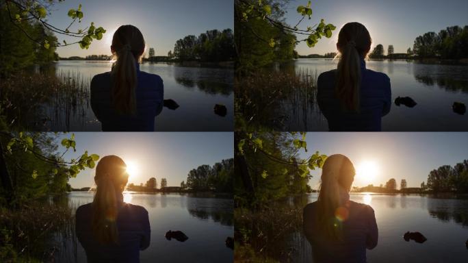 孤独的女孩站在湖边