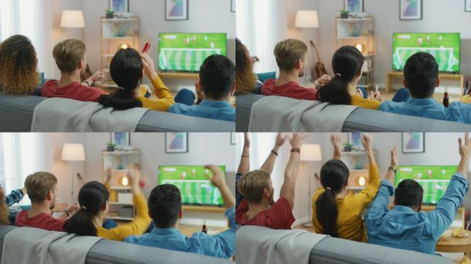 体育迷坐在沙发上观看电视上的重要足球比赛