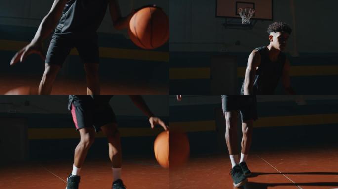 男性运动员在健身房用两个球练习篮球运动