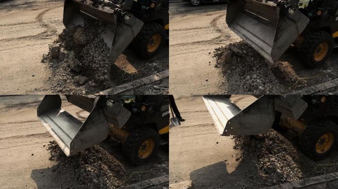 装载机的铲斗在铲土。