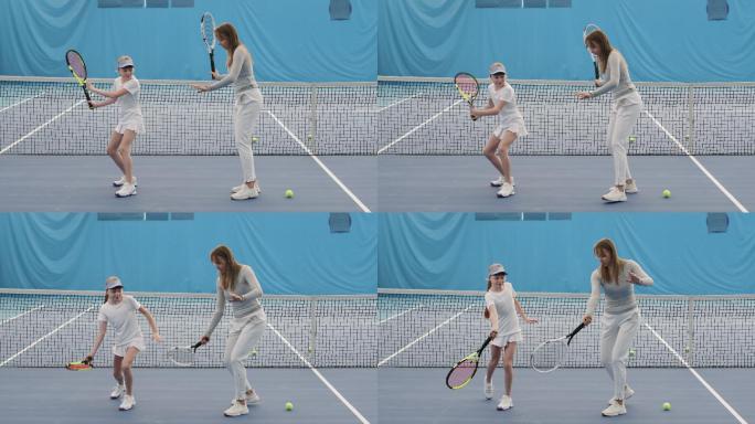 教练教小女孩如何用网球拍