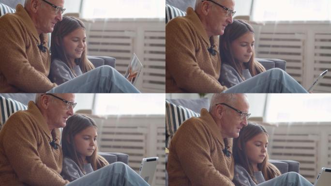 爷爷和孙女使用平板电脑