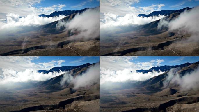 云层覆盖的山峰的航拍