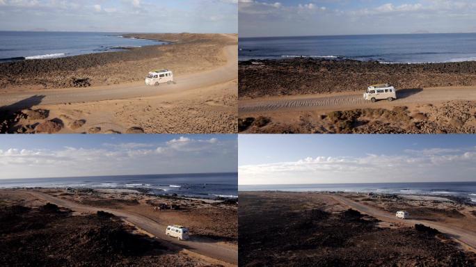 海岸公路行驶的汽车寻找完美的冲浪地点