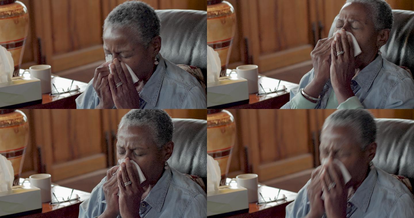 老年妇女打喷嚏，用面巾纸擤鼻涕