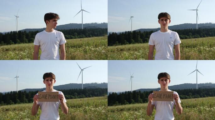 举起“拯救地球生态”标语牌的男性