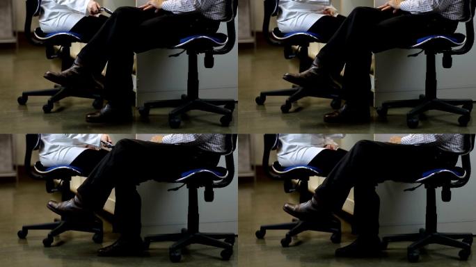 神经科医生检测男性患者的膝反射