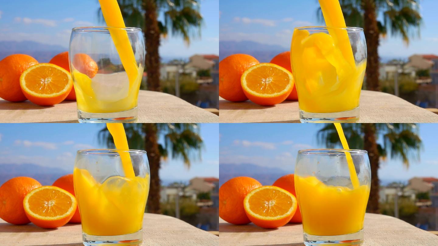 特写橙汁倒进玻璃杯