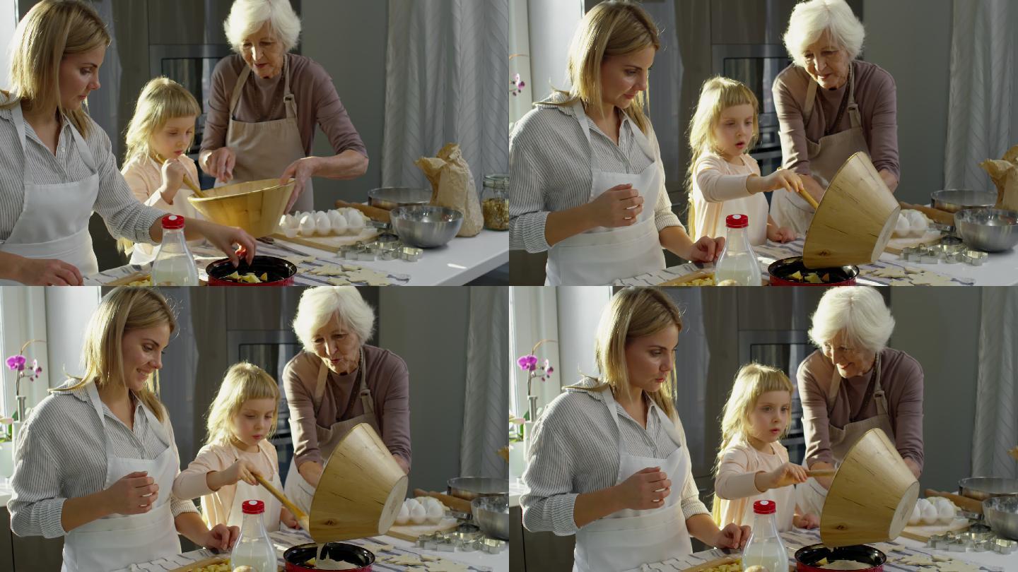 妈妈和奶奶和小女孩一起做苹果派