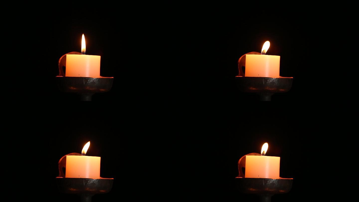 【实拍】点燃的蜡烛黑幕素材