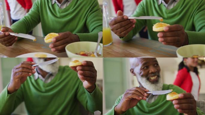 老人在家和家人一起吃早餐时涂果酱