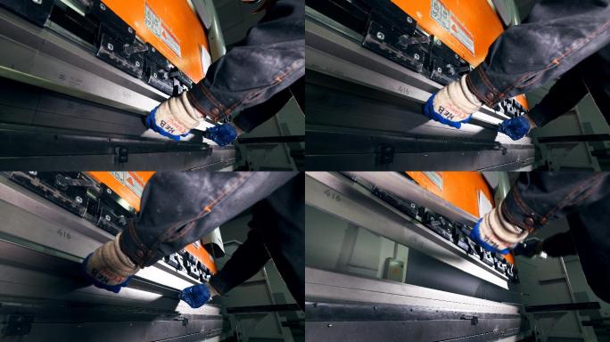 在CNC液压机制动器上使用金属板的工人