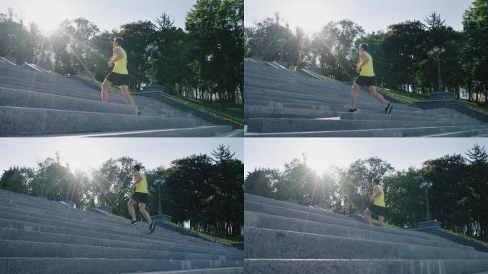 健身男子在公园的楼梯上慢跑