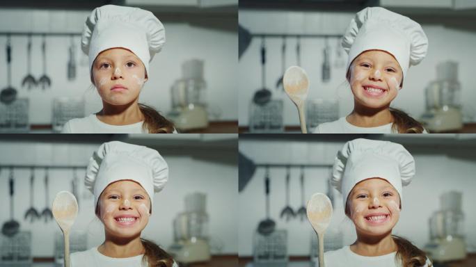 一个戴着厨师帽的漂亮小女孩