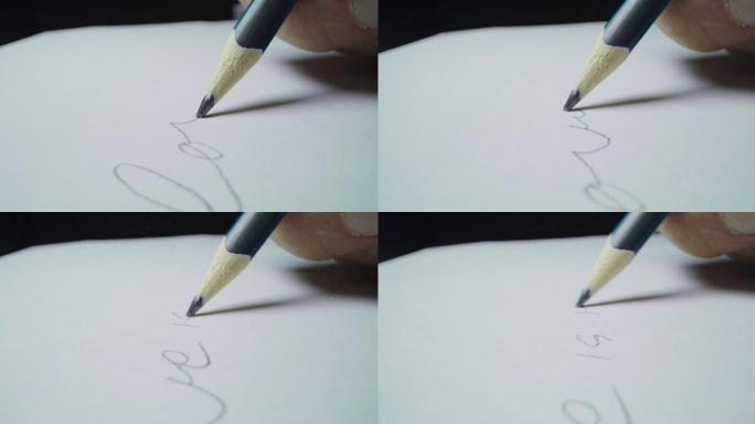 一只手用铅笔写一个单词
