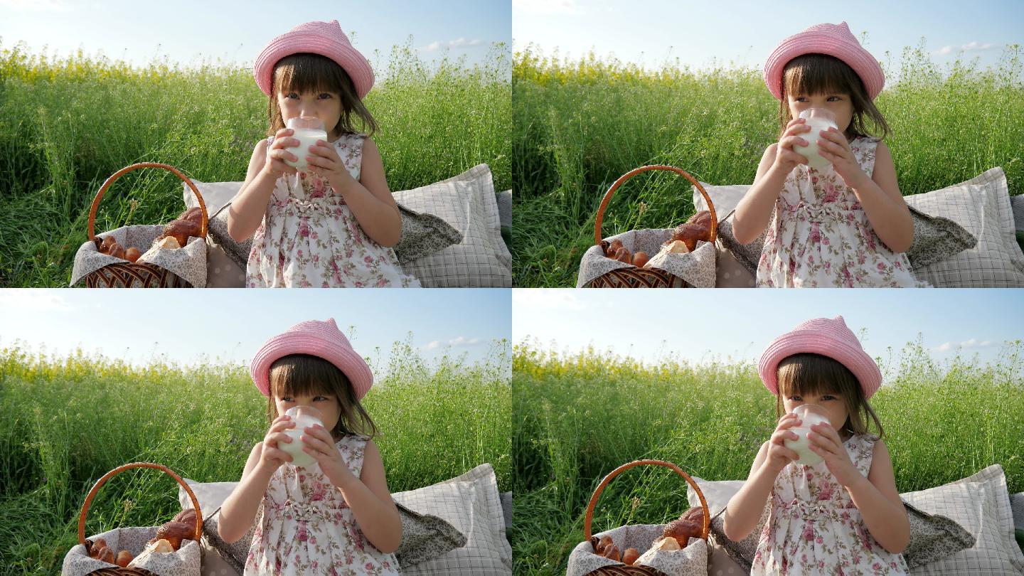 可爱女孩周末野餐小女孩户外喝牛奶野炊野餐