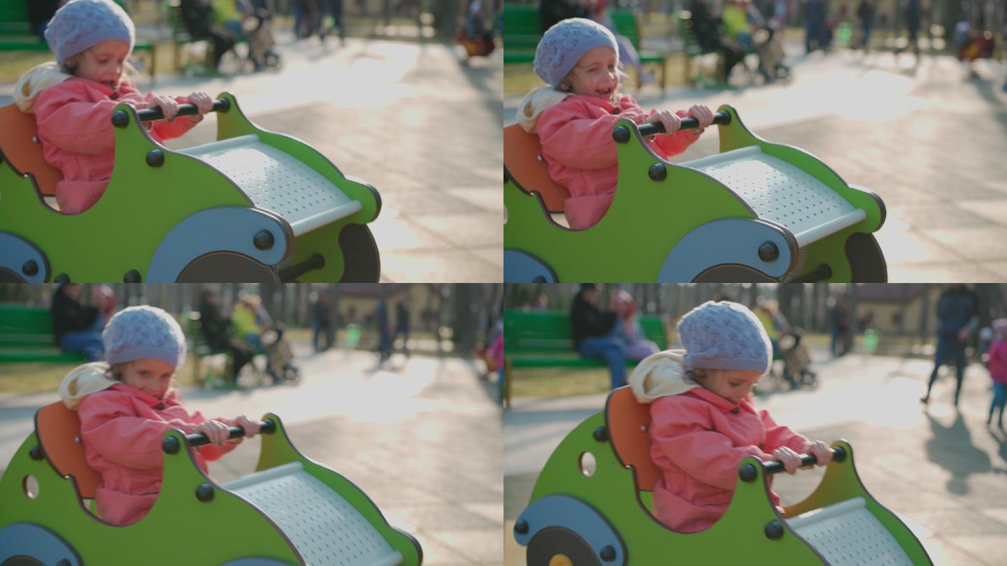 小女孩在玩具木车上玩