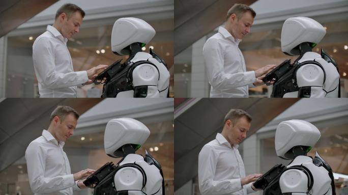 购物中心里的男人与机器人顾问交流
